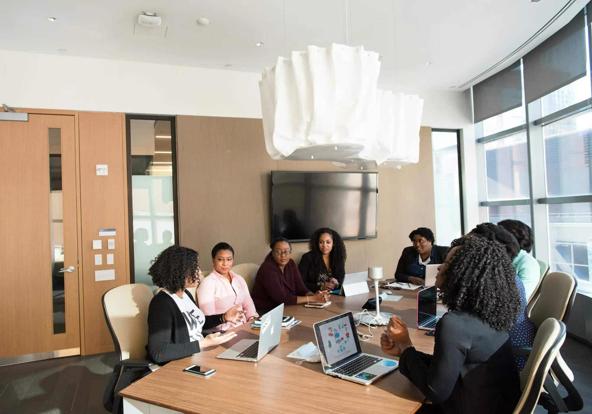 African business professionals discussing campaign strategy in an office